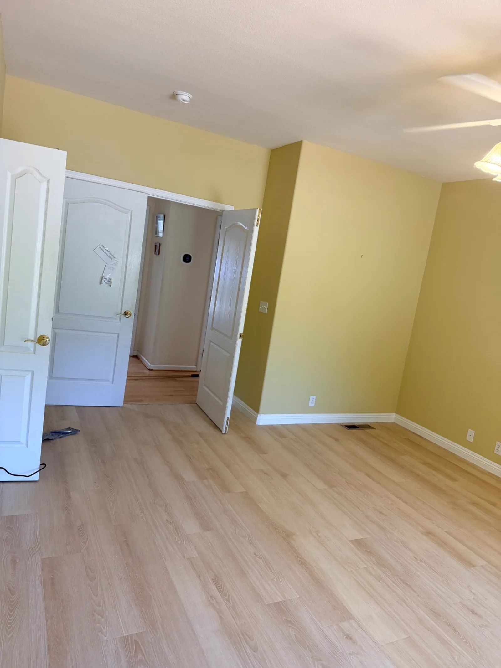 New flooring installation with open doorway